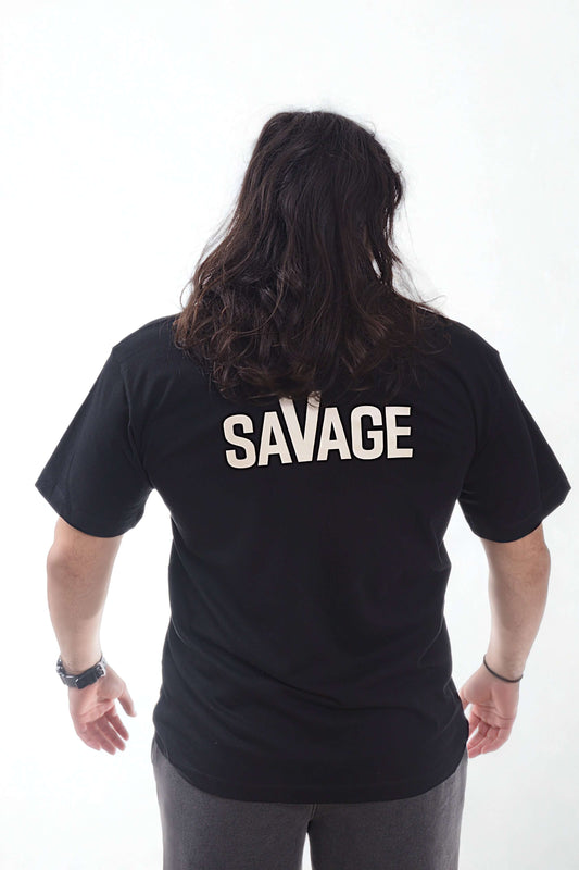 Heavyweight T Shirt - Raw Line worn by model showing the back with 'SAVAGE' printed in bold.