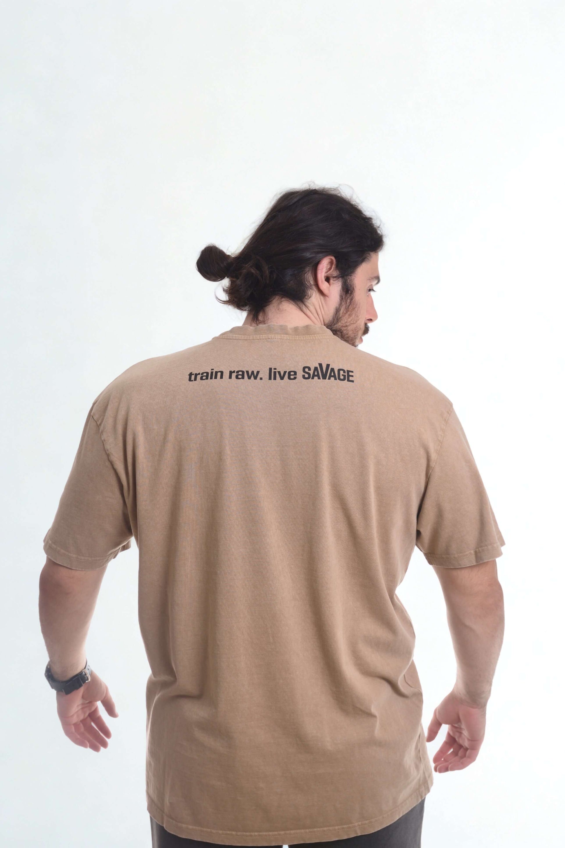 Vintage oversized shirt featuring 'train raw. live SAVAGE' on the back, showcasing quality and comfort.